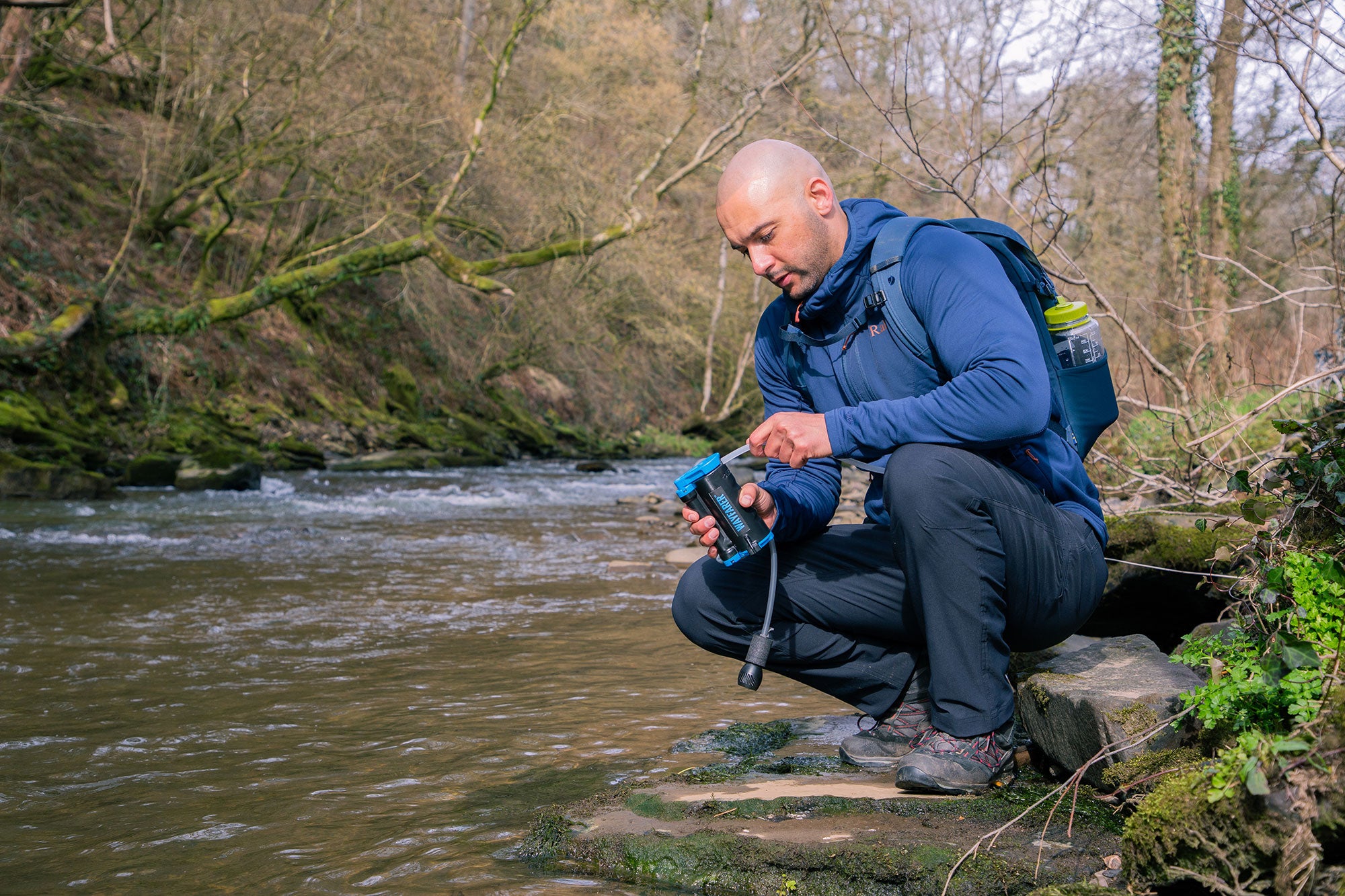 Filling a LifeSaver Wayfarer by a river